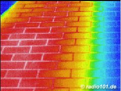 Thermographic picture - infrared photograph: hot tiles on a balcony in the summertime, partially shadowed